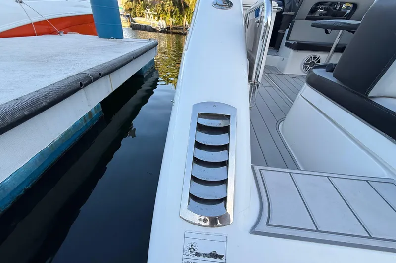  Yacht Photos Pics Schaefer 303 boat, 2021 model, docked with sleek white design and modern seating.