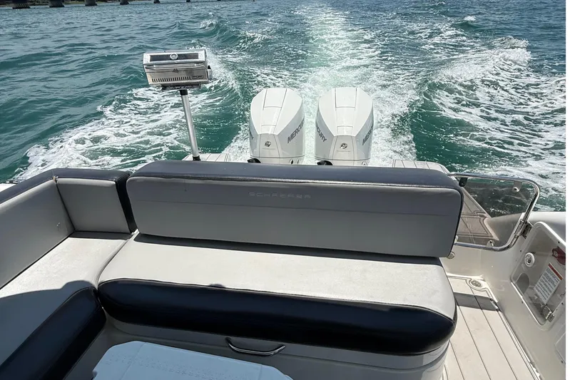  Yacht Photos Pics Schaefer 303 boat, 2021 model, cruising on open water with twin Mercury engines.