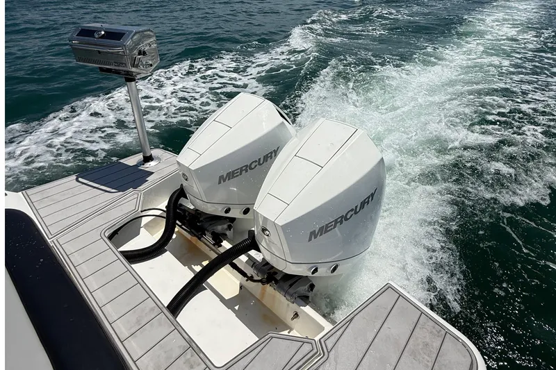  Yacht Photos Pics Twin Mercury outboard engines on a 2021 Schaefer 303 boat, cruising on open water.