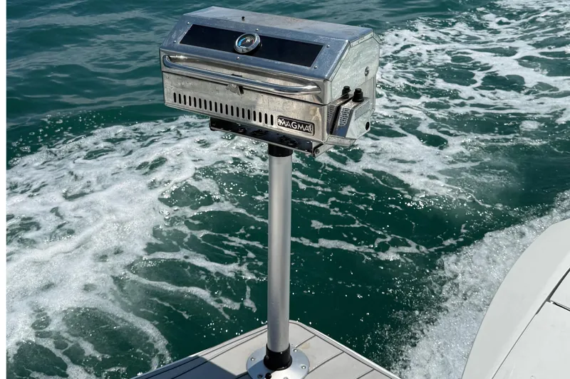 Yacht Photos Pics Boat-mounted Magma grill on Schaefer 303, 2021 model, with ocean backdrop.