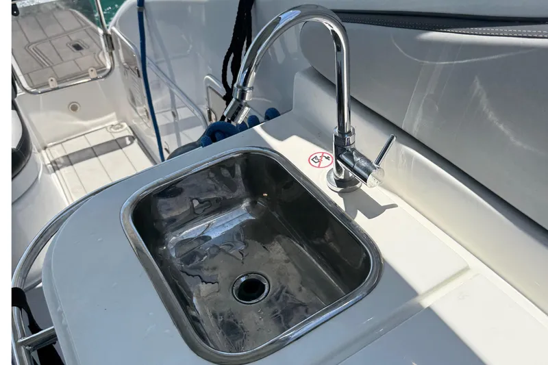  Yacht Photos Pics Stainless steel sink and faucet on 2021 Schaefer 303 boat deck.