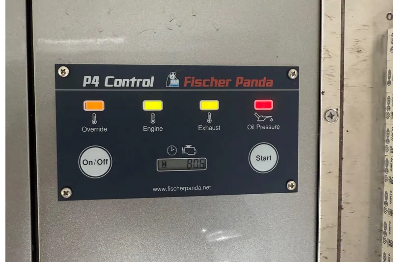  Yacht Photos Pics Control panel of Fischer Panda P4 with indicators for override, engine, exhaust, and oil pressure.