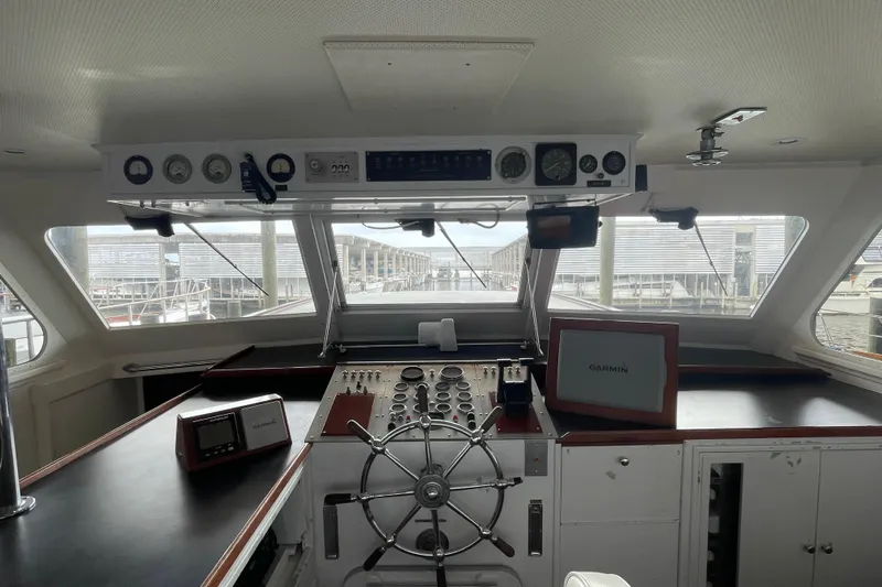 Georgia Yacht Photos Pics Interior view of a 1967 Huckins Offshore boat cockpit with navigation instruments.