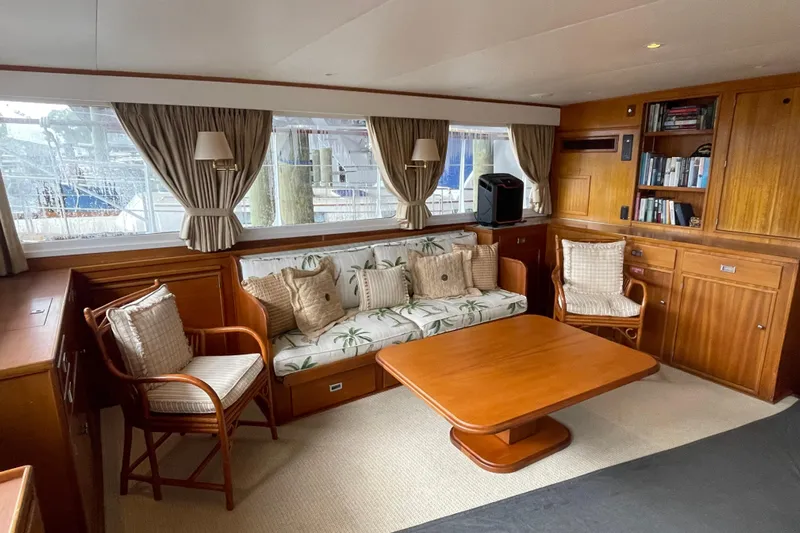 Georgia Yacht Photos Pics Interior of a 1967 Huckins Offshore yacht with elegant wood furnishings and cozy seating.