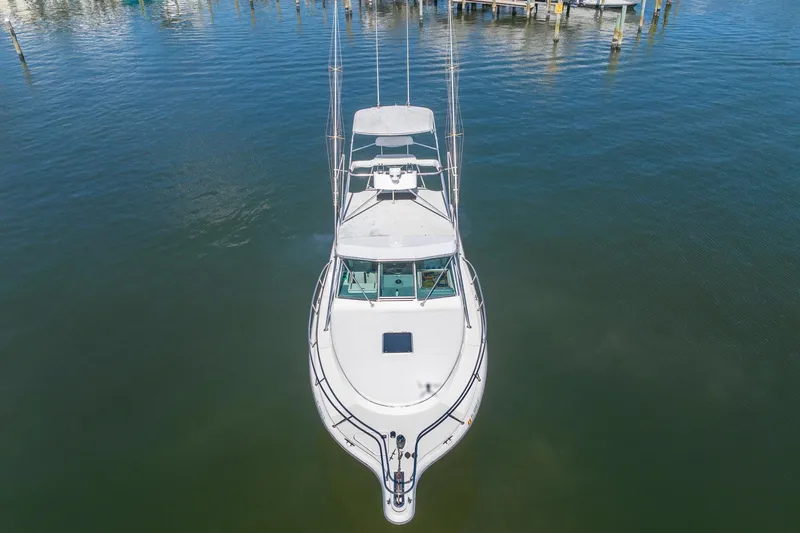  Yacht Photos Pics Aerial view of a 1997 Tiara Yachts 3500 Express boat docked in calm waters.