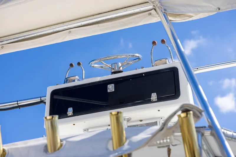  Yacht Photos Pics 1997 Tiara Yachts 3500 Express helm with blue sky background.