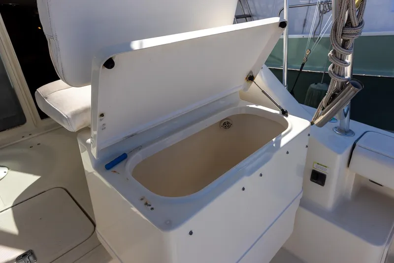  Yacht Photos Pics Open storage compartment on 1997 Tiara Yachts 3500 Express boat deck.