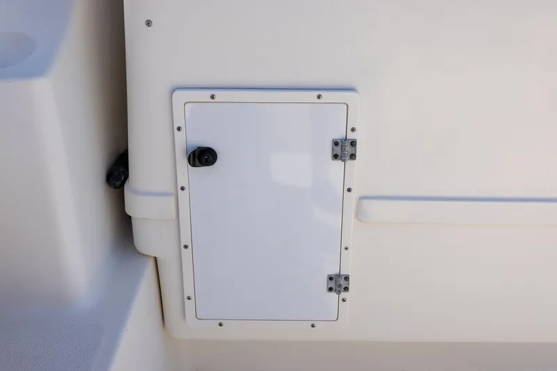  Yacht Photos Pics Access panel on 1997 Tiara Yachts 3500 Express boat, featuring a white hinged door.