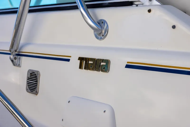  Yacht Photos Pics 1997 Tiara Yachts 3500 Express boat detail with logo and railing.