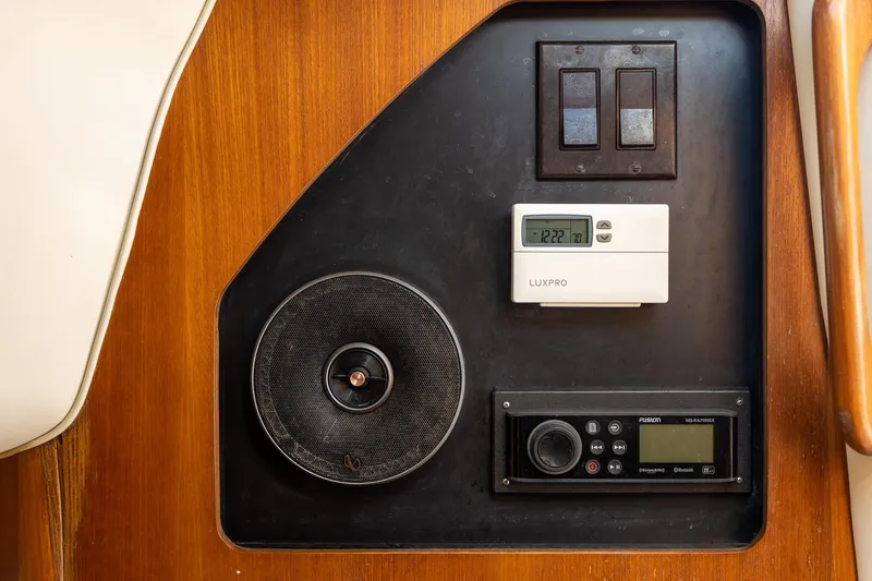  Yacht Photos Pics Control panel on 1997 Tiara Yachts 3500 Express with speaker, thermostat, and radio.