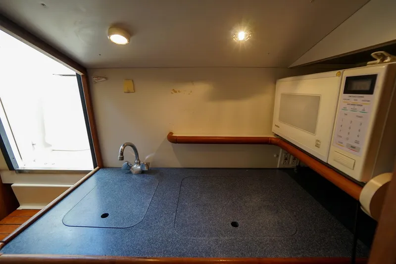  Yacht Photos Pics 1997 Tiara Yachts 3500 Express galley with sink and microwave.