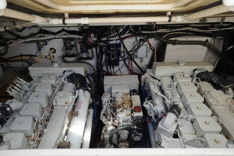  Yacht Photos Pics Engine room of a 1997 Tiara Yachts 3500 Express, showcasing dual engines and wiring.