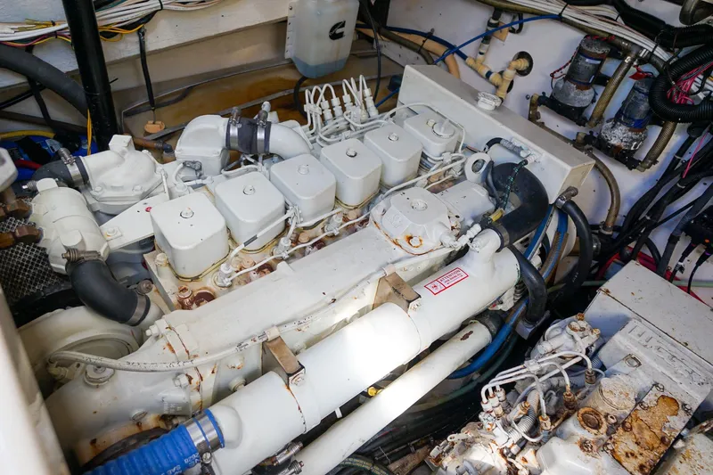  Yacht Photos Pics Engine room of a 1997 Tiara Yachts 3500 Express, showcasing mechanical components and wiring.