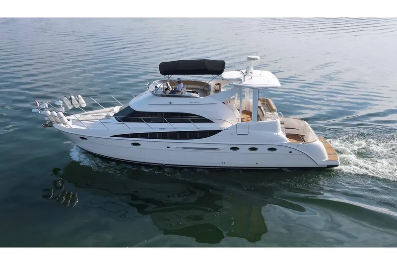 This Bar Yacht Photos Pics 2004 Meridian 459 Motoryacht cruising on calm waters, showcasing elegant design and luxury features.