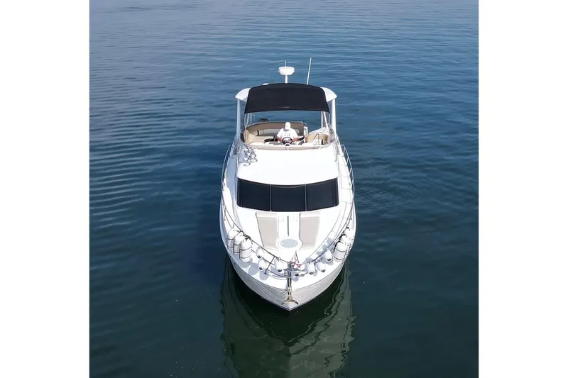 This Bar Yacht Photos Pics 2004 Meridian 459 Motoryacht on calm water, aerial view.
