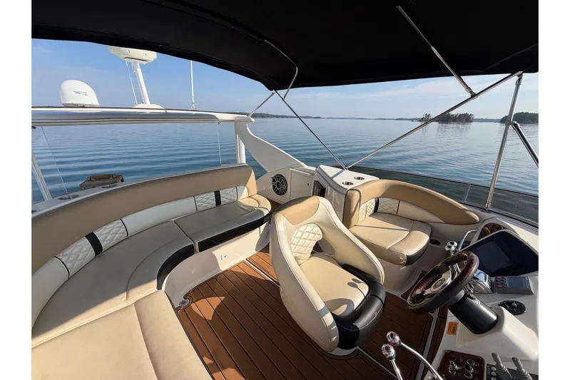 This Bar Yacht Photos Pics Luxurious 2004 Meridian 459 Motoryacht interior with plush seating and scenic water view.