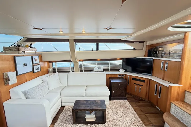 This Bar Yacht Photos Pics Luxurious interior of 2004 Meridian 459 Motoryacht with white sofa and modern decor.