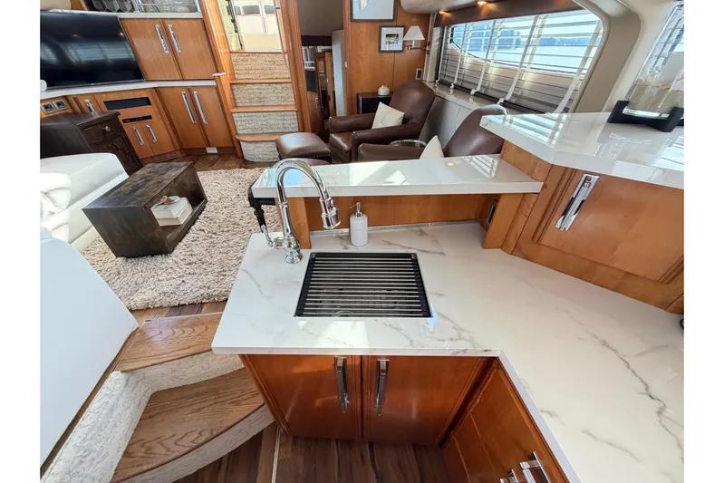 This Bar Yacht Photos Pics Luxurious interior of 2004 Meridian 459 Motoryacht with modern kitchen and cozy seating area.