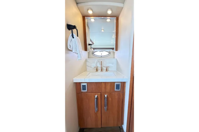 This Bar Yacht Photos Pics 2004 Meridian 459 Motoryacht bathroom with wooden cabinetry and modern sink design.