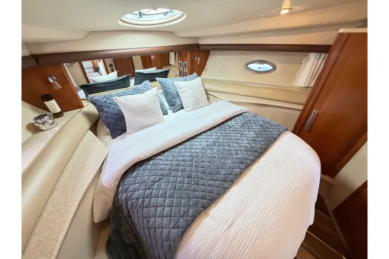 This Bar Yacht Photos Pics Luxurious bedroom interior of 2004 Meridian 459 Motoryacht with elegant bedding and wood accents.