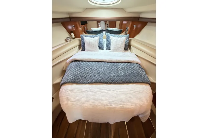 This Bar Yacht Photos Pics Luxurious bedroom interior of 2004 Meridian 459 Motoryacht with elegant bedding and wood accents.