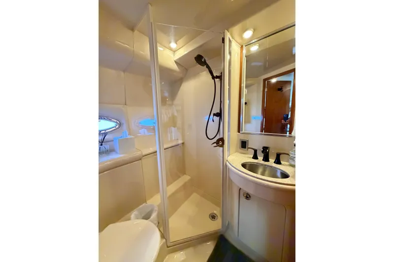 This Bar Yacht Photos Pics Luxurious bathroom in 2004 Meridian 459 Motoryacht with shower and sink.