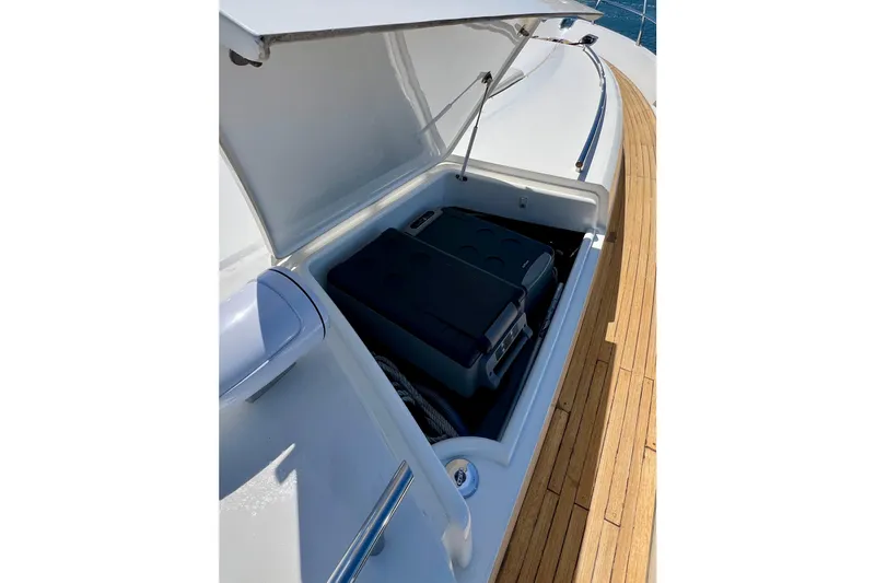  Yacht Photos Pics Storage compartment on 2010 Princess V78 yacht with wooden deck and open hatch.