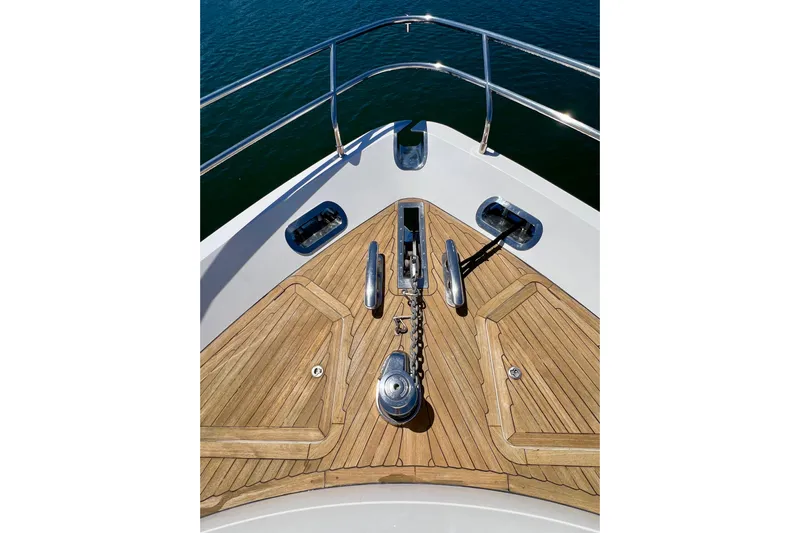  Yacht Photos Pics Bow of 2010 Princess V78 yacht with teak decking and anchor chain.