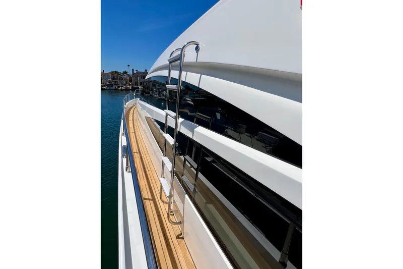  Yacht Photos Pics Side view of 2010 Princess V78 yacht with sleek design and wooden deck.