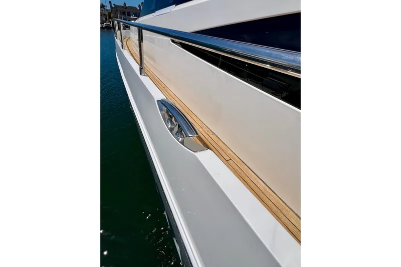  Yacht Photos Pics Side view of a 2010 Princess V78 yacht with sleek design and polished railing.