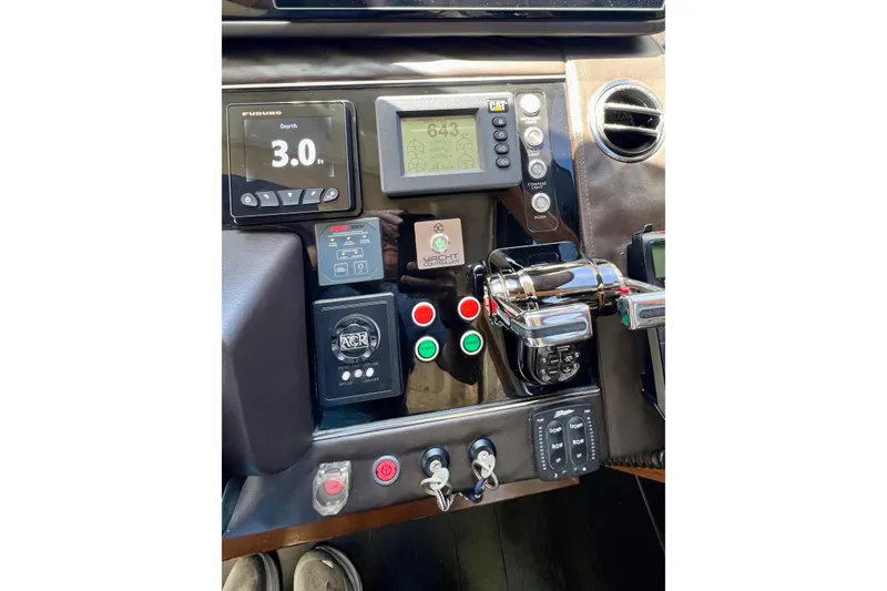  Yacht Photos Pics Control panel of a 2010 Princess V78 yacht with various instruments and displays.