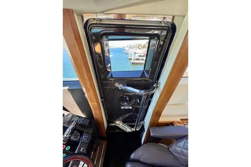  Yacht Photos Pics Interior view of 2010 Princess V78 yacht, showcasing helm and ocean view.