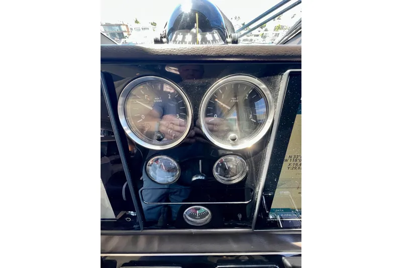  Yacht Photos Pics Dashboard of a 2010 Princess V78 yacht with gauges and navigation display.