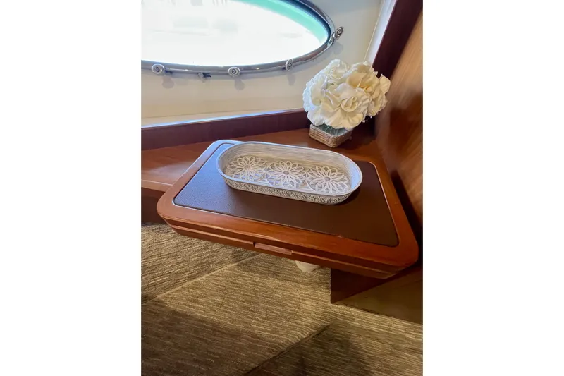  Yacht Photos Pics Luxurious interior of 2010 Princess V78 yacht with elegant decor and floral arrangement.