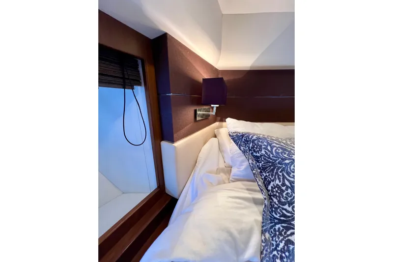  Yacht Photos Pics Luxurious bedroom interior of 2010 Princess V78 yacht with elegant bedding and modern lighting.