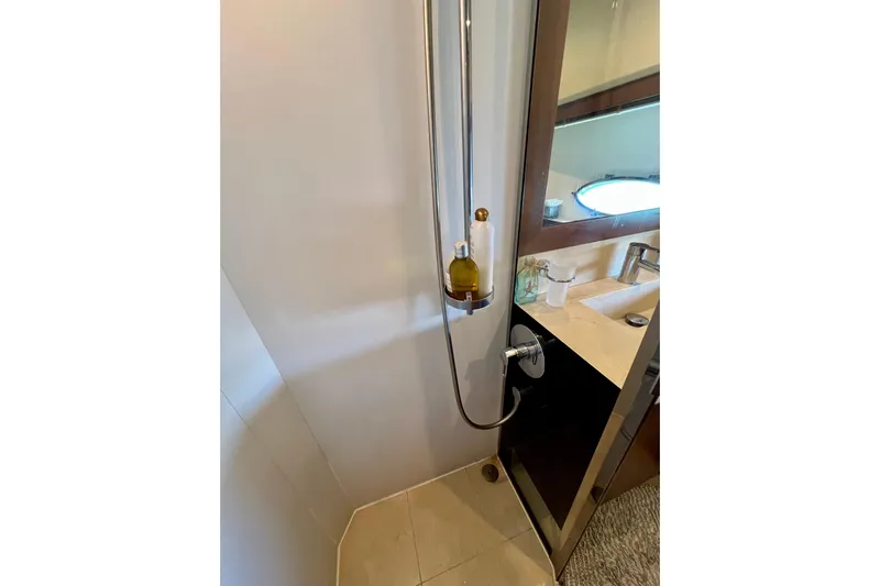  Yacht Photos Pics Bathroom interior of 2010 Princess V78 yacht with shower and sink area.