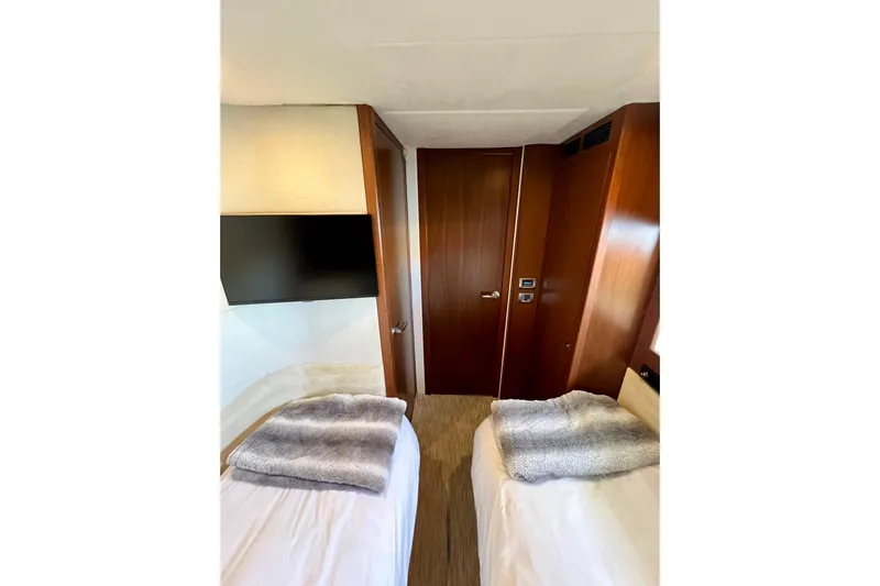  Yacht Photos Pics Interior of 2010 Princess V78 yacht with twin beds and modern decor.