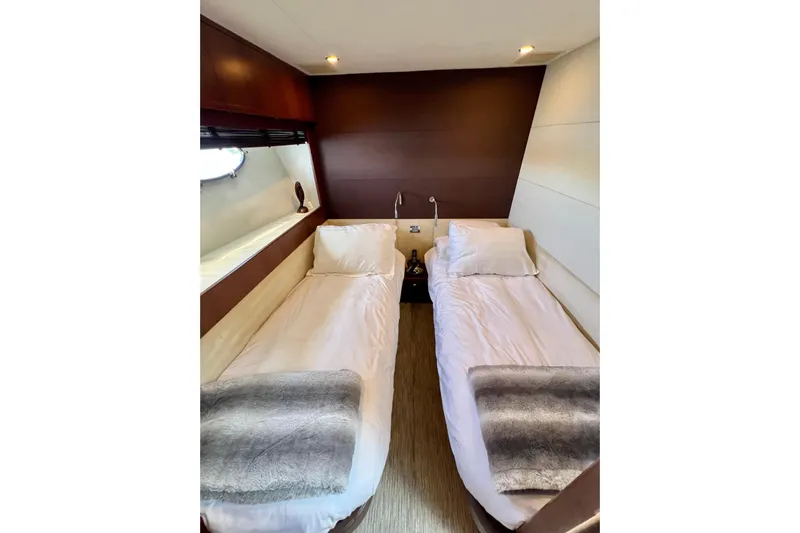  Yacht Photos Pics Luxurious twin cabin in 2010 Princess V78 yacht with modern decor and cozy bedding.