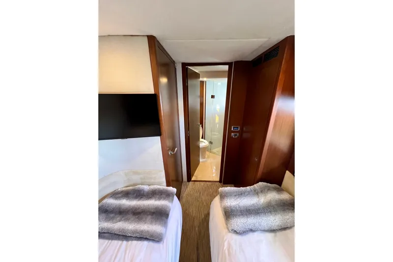  Yacht Photos Pics Luxurious 2010 Princess V78 yacht cabin with twin beds and ensuite bathroom.