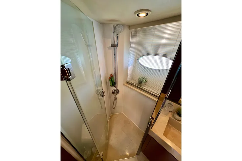  Yacht Photos Pics Luxurious shower in 2010 Princess V78 yacht with modern fixtures and natural light.