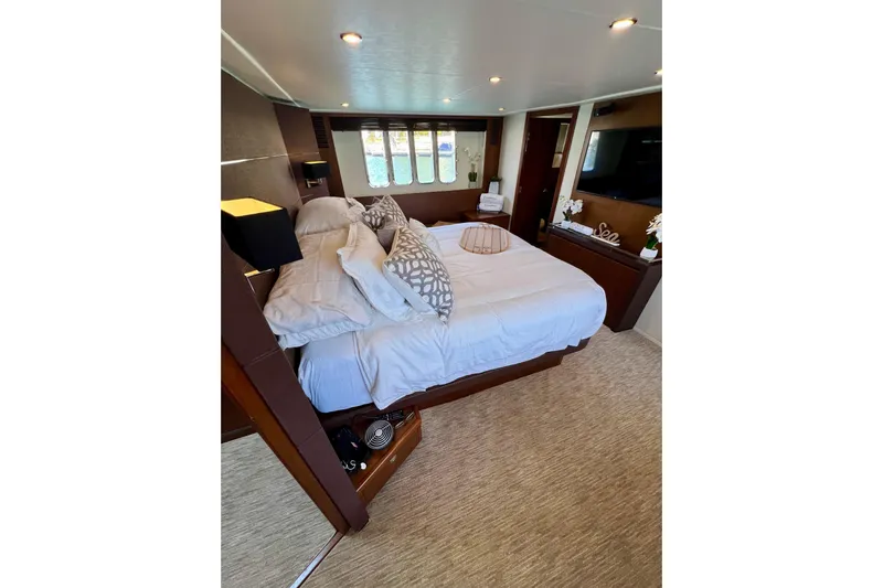  Yacht Photos Pics Luxurious bedroom interior on 2010 Princess V78 yacht with elegant decor and comfortable bedding.