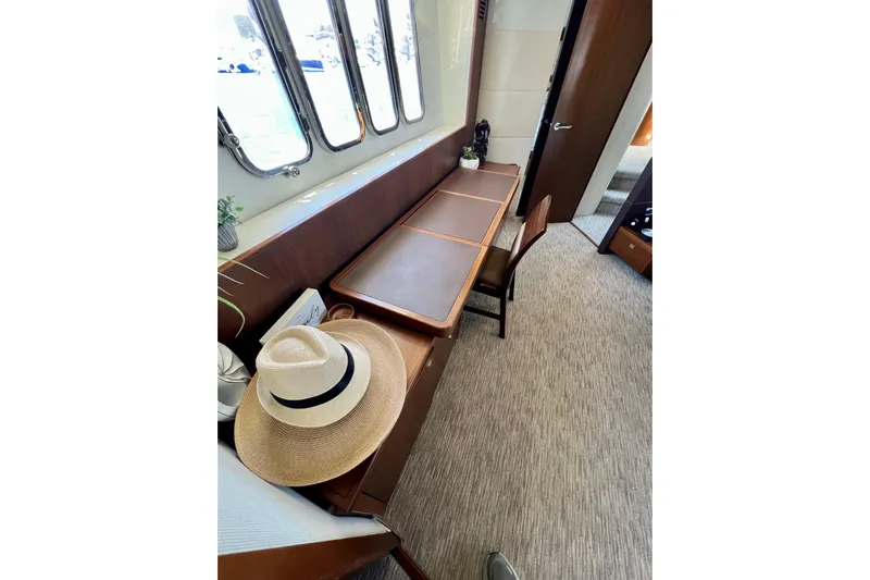  Yacht Photos Pics Luxurious interior of 2010 Princess V78 yacht with elegant desk and chair setup.