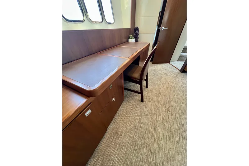  Yacht Photos Pics Luxurious interior of 2010 Princess V78 yacht with elegant wooden desk and chair.