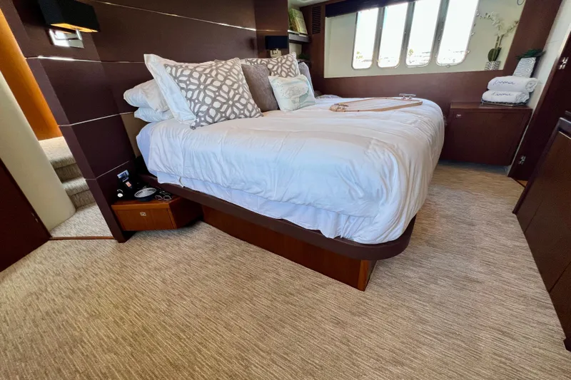  Yacht Photos Pics Luxurious bedroom interior of 2010 Princess V78 yacht with elegant bedding and decor.