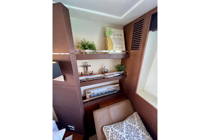  Yacht Photos Pics Luxurious 2010 Princess V78 yacht interior with decorative shelves and cozy seating.