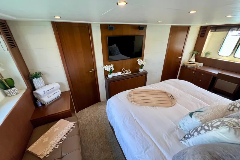  Yacht Photos Pics Luxurious 2010 Princess V78 yacht bedroom with elegant decor and modern amenities.