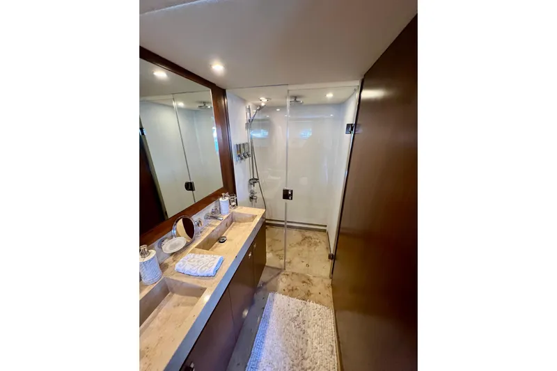  Yacht Photos Pics Luxurious bathroom in 2010 Princess V78 yacht with glass shower and elegant vanity.