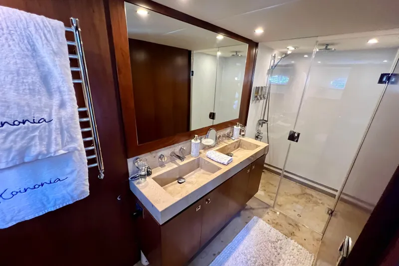  Yacht Photos Pics Luxurious bathroom on 2010 Princess V78 yacht with glass shower and elegant vanity.