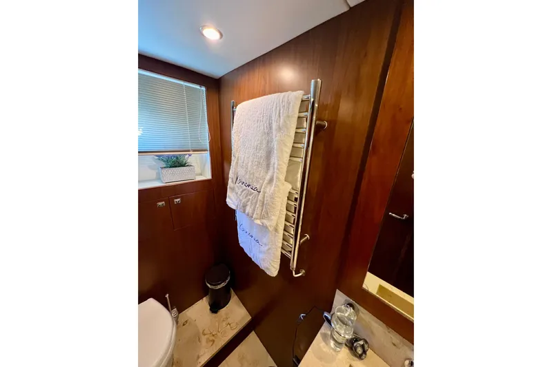  Yacht Photos Pics Luxurious bathroom in 2010 Princess V78 yacht with wooden paneling and towel rack.