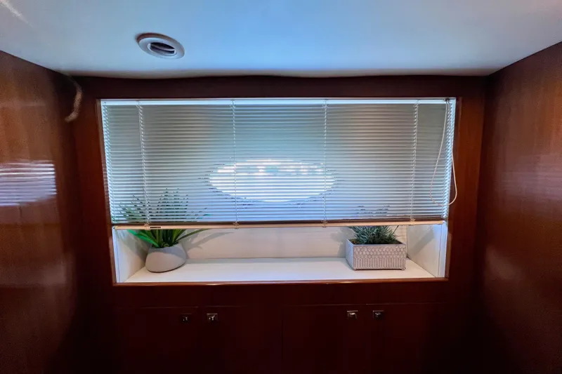  Yacht Photos Pics Interior of 2010 Princess V78 yacht with window blinds and decorative plants.